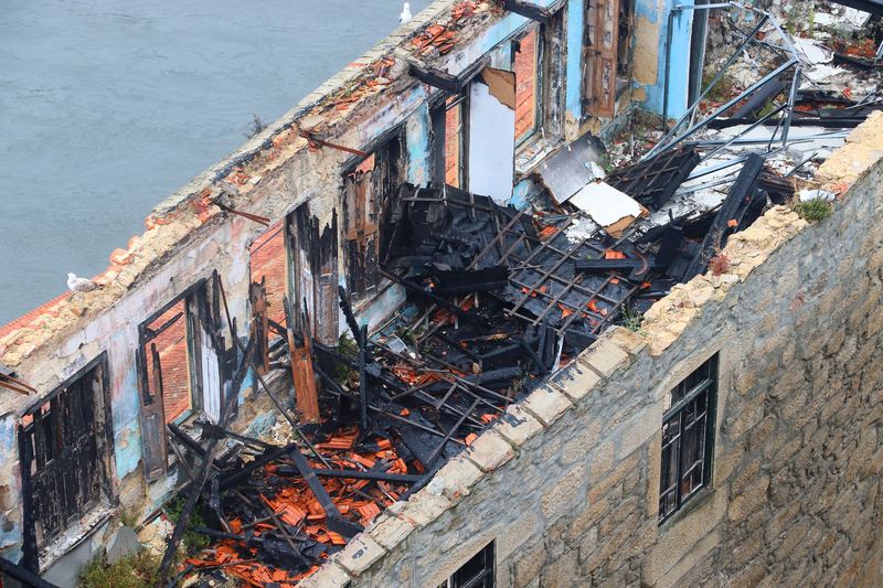 Historic building with collapsed roof after fire
